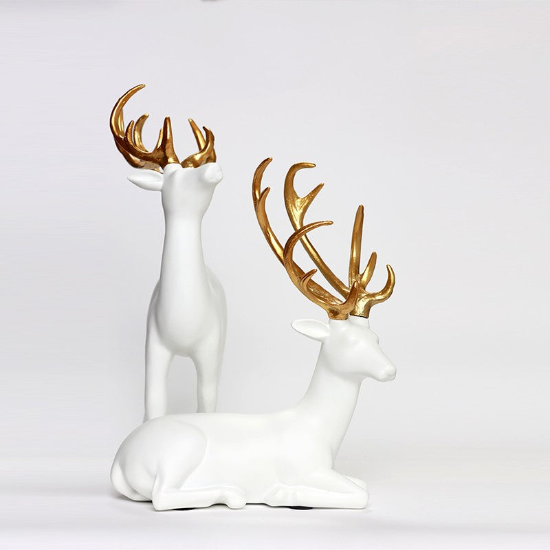 SÉRIE DE DEUX STATUES DE DÉCORATION GAZELLE BLANCS DORÉS EN RÉSINE