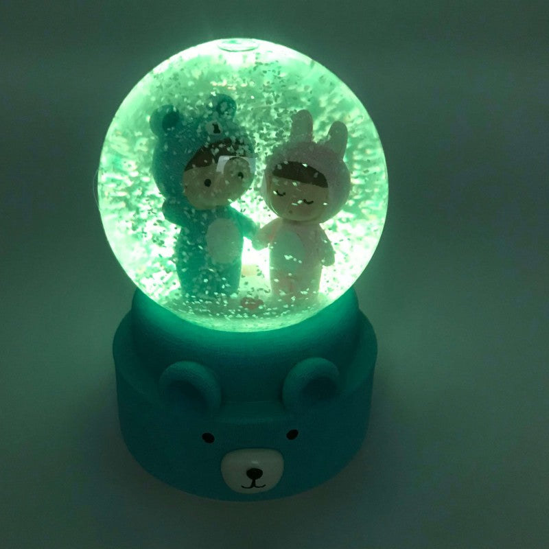 BOULE DE NEIGE AVEC MOTIF DEUX BÉBÉS