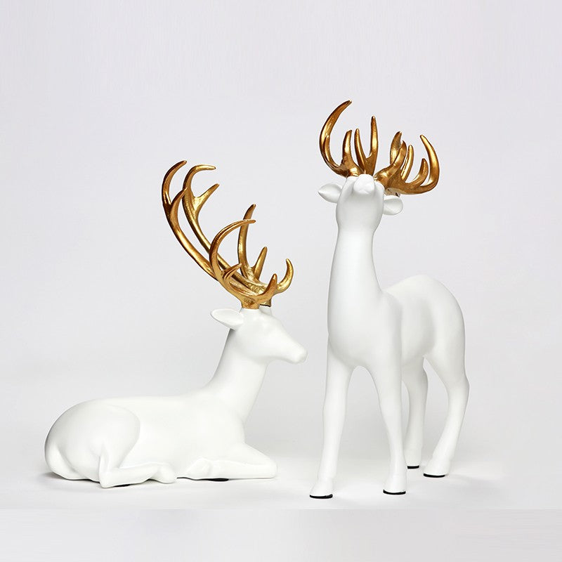 SÉRIE DE DEUX STATUES DE DÉCORATION GAZELLE BLANCS DORÉS EN RÉSINE