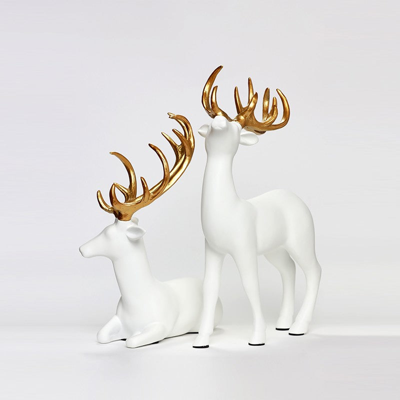 SÉRIE DE DEUX STATUES DE DÉCORATION GAZELLE BLANCS DORÉS EN RÉSINE